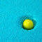 green ball squished into a background of tiny aqua foam pebbles