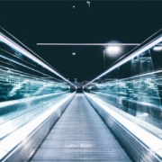 moving walkway in tunnel of lights